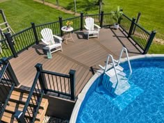 an above ground pool with decking and chairs