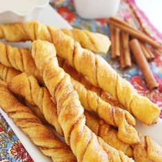 some bread sticks are on a white plate