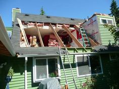 a house that has been torn down with the roof ripped off