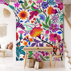 a colorful floral wallpaper in a living room with white walls and wooden steps leading up to the second floor