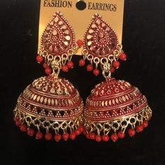 Beautiful Gold And Red Color Jhumka Earring Red Jhumkas Earrings, Jumka Earrings Gold Indian Jewelry, Red Earrings Indian, Bohemian Red Jhumkas With Latkans, Elegant Jhumkas For Festive Occasions, Red Jewelry With Matching Earrings For Diwali, Red Chandelier Earrings For Festive Parties, Festive Red Chandelier Earrings For Party, Red Chandelier Earrings For Party And Festive Occasions