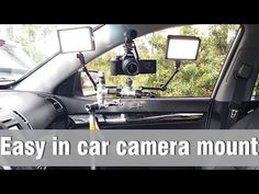 the inside of a car with camera mounted to it's dash and front seats