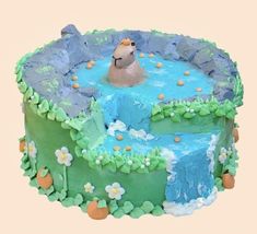 a birthday cake with a bear in the water