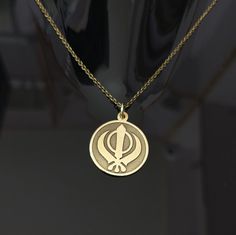 About Item  Item           :- Khanda Pendant Material   :- Sterling silver & Brass Item Title :- Sterling Silver KHANDA Pendant, Handmade Sikh Khalsa Necklace, Religious Charm Necklace, Sikh Jewelry, Handmade Gift For Him NOTE Q1. Does Brass Jewelry Turn Your Skin Green? The Science Behind Brass Turning Skin Green Brass jewelry can turn skin green due to a chemical reaction between the metal and your sweat. This reaction is caused by the copper in the brass oxidizing when it comes into contact w Luxury Round Temple Necklace As Gift, Guru Govind, Handmade Gift For Him, Handmade Gifts For Him, Unique Pendant Necklace, Waheguru Ji, Black Beaded Jewelry, Frame Gallery, Necklace Online