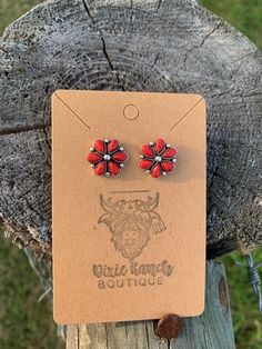 Super Cute Small Western Stud Earrings Featuring Red Faux Stones Earrings Measure 0.60 inches round ** Made with alloy metals Red Western Jewelry, Red Round Metal Earrings, Red Round Flower Earrings With Ear Wire, Red Flower Earrings For Pierced Ears, Nickel Free Red Earrings, Red Nickel Free Drop Flower Earrings, Red Nickel-free Drop Flower Earrings, Nickel-free Red Round Earrings, Red Cluster Earrings For Pierced Ears As Gift