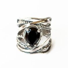 A cut black onyx is a bezel and prong set in our very unique sterling silver setting. With zigs, zags, oxidized details and smooth silver details this handcrafted ring makes are sure to make a statement. Available in whole sizes 6-10, and tapers in the back for a very comfortable fit. Handcrafted .925 sterling silver onyx Unique Black Oxidized Finish Ring, Unique Black Ring With Oxidized Finish, Black Oxidized Ring Jewelry, Black Oxidized Finish Ring, Handcrafted Silver Jewelry, Tanzanite Gemstone, Blue Tanzanite, Black Onyx Ring, Handcrafted Rings