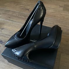 Authentic, Lovely (Nwt/Box) Saint Laurent Black Leather Stiletto Heels! These Heels Make A Statement! Corset Design On Back Make Them Unique! Heel Height 5.5 Inches, Platform .75 Inches. Pointed Toe, Size 40 (Us 10). They Run Small!! Comes With Box, Dust Bag, Heel Replacements (Receipt Available). Open To Reasonable Offers Only! No Low Ball Offers!!!! Thank You For Looking! No Trades. My Packages Ship Everyday (Mon.-Fri.) Occasionally Saturdays Leather Platform Court Shoes For Party, Evening Leather Platform Court Shoes, Calf Leather Almond Toe Heels For Night Out, Calf Leather Heels With Almond Toe For Night Out, Calf Leather Heels With Sculpted Heel For Night Out, Luxury Round Toe Heels For Night Out, Calf Leather High Heels For Evening, Almond Toe Calf Leather Heels For Night Out, Leather Sole Closed Toe Heels For Night Out