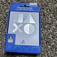 the box for the playstation 4 is shown on the carpet in front of it's packaging