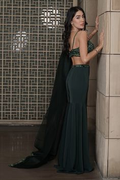 Emerald green bustier with sequins, beads hand embroidery and hem detailed with crystals. Paired with a gharara with matching embroidered waist band and dupatta with fringe detailed border. - Aza Fashions Fitted Sleeveless Sharara For Party, Fitted Sleeveless Sharara For Reception, Glamorous Fitted Green Choli, Evening Fitted Sharara With Unstitched Blouse, Fitted Sleeveless Sharara For Wedding, Beads Hand Embroidery, Green Sequins, Set For Women, Waist Band