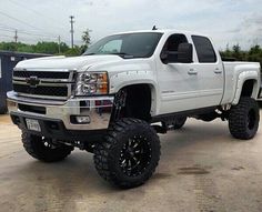 a white truck parked in a parking lot