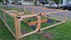 an outdoor garden in the middle of a neighborhood