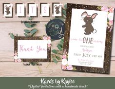 an easter bunny baby shower party with pink flowers and greenery on the wood floor