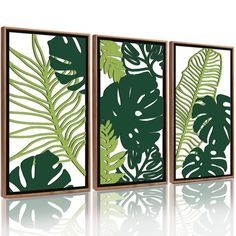 three green and white paintings with leaves on them