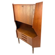 a small wooden cabinet with drawers on one side and an open drawer on the other