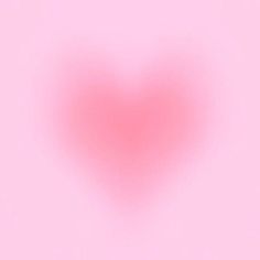 a heart shaped object on a pink background