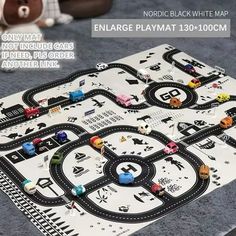 an image of a play mat with cars and trucks on it for children to play