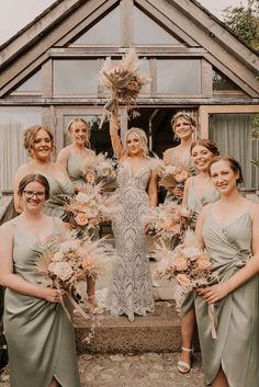 Bride in a boho lace fitted Willowby by Watters wedding dress with the bridal party in sage green satin bridesmaid dresses all holding pink rose and pampas grass bouquets Boho Bridesmaid Dress Sage Green, Rustic Boho Wedding Bridesmaid Dresses, Boho Rustic Bridesmaid Dress, Sage Green Pampas Wedding, Green Bridesmaid Dresses Satin, Boho Wedding Bridesmaids Dresses, Sage Boho Wedding, Boho Wedding Bridesmaid Dresses, Boho Bridesmaid Dress