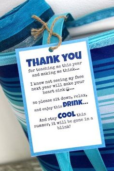 a blue and white striped bag with a thank card attached to it