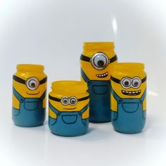 four yellow and blue jars with eyes on them