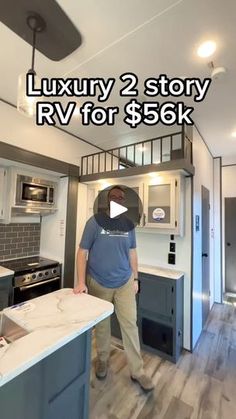 a man standing in a kitchen next to a stove top oven and microwave with the words luxury 2 story rv for $ 59k