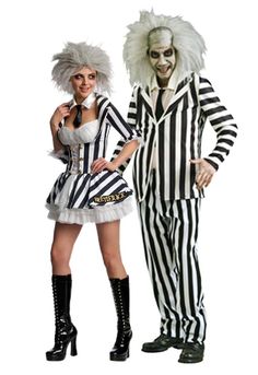 two people dressed in costumes standing next to each other, one wearing a striped suit and the other as a clown