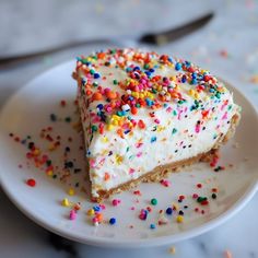 a piece of cake on a plate with sprinkles