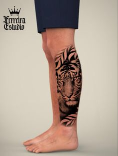 a man's leg with a tiger tattoo on it and leaves around the legs