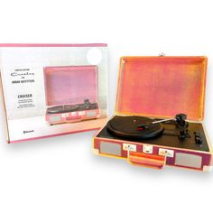 an open suitcase with a record player in it