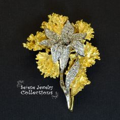 Fancy Yellow 18k gold Vintage Diamond Flower Brooch! This brooch separates into two different brooches. One is 18k white gold and set with 4.06 carats of diamonds. The larger 18k yellow gold brooch wraps around the inner brooch seamlessly. Please refer to one of the hand photos to view the pieces separated. Total Weight: 32.06 grams Size: 2.2 inches tall, 1.8 inch wide Precious Metal: 18k yellow gold Precious stones: -White Round Diamonds: 4.06 carats Hallmark: 18k Elegant Yellow Flower Brooches, Exquisite Diamond Brooches In Yellow Gold, Exquisite Yellow Gold Diamond Brooches, Diamond Flower Brooch For Formal Occasions, Formal Diamond Flower Brooch, Hand Photos, Diamond Flower Brooch, Hand Photo, Platinum Diamond Rings