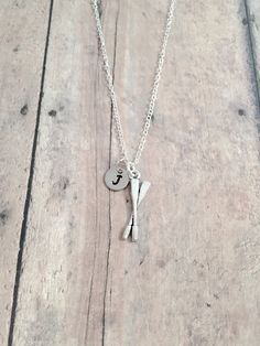 "This listing is for a hand-stamped initial necklace featuring a 9/10\" x 3/10\" silver toned oars charm & 3/10\" stainless steel initial pendant. The silver plated chain is 18\" long, but can be made to your desired length- see last photo in listing. Please indicate the chain length you would like in the 'notes to seller' section at checkout. All items are lead & nickel free. Message me with any questions, thank you! Add an initial to any necklace https://www.etsy.com/listing/170461597/ Rowing Gifts, Family Tree Necklace, Tyler Tx, Tree Necklace, Brass Necklace, Initial Pendant, Rowing, Necklace Gift, Name Necklace