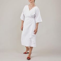 Explore our Handcrafted White Linen Wrap Dress for Women, featuring a flattering half-sleeve midi design with a tie waist for an adjustable fit. This dress includes side pockets and a V-neck cut, with the back of the skirt lined to prevent any transparency, ensuring elegance and comfort. Ideal for everyday city life, work engagements, leisure outings, and perfect as a summer vacation dress. Available in a variety of colors, from light beige to dark brown, along with shades of blue and more. Shou Summer Midi Dress With Belt And Half Sleeves, Summer Midi Dress With Belt And 3/4 Sleeves, Belted Short Sleeve Wrap Dress For Brunch, Belted Half Sleeve Midi Dress For Work, Summer Half Sleeve Dress With Tie Waist, Summer Wrap Maxi Dress For Work, Half Sleeve Summer Midi Dress For Workwear, Short Sleeve Midi Dress With Tie Waist For Brunch, Brunch Tie Waist Wrap Midi Dress