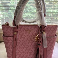 Authentic. Measures 12”Top, 10”Bottom, 8”Tall, 4.5” Deep. New As Shown. Michael Kors Pink Tote Bag, Michael Kors Pink Double Handle Satchel, Luxury Pink Michael Kors Shoulder Bag, Michael Kors Blush Bags With Gold-tone Hardware, Michael Kors Pink Shoulder Bag With Gold-tone Hardware, Michael Kors Bag, Dusty Pink, Satchel, Michael Kors