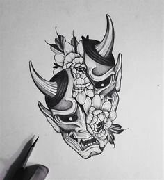 a drawing of a skull with horns and flowers on its head, in black ink