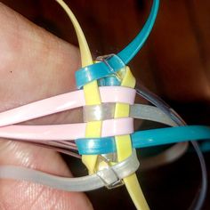 a person is holding some kind of colorful object in their hand and it looks like they are connected to wires