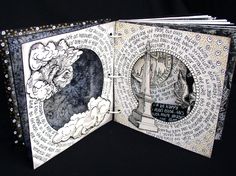 an open book with black and white designs on it's pages, showing the inside page