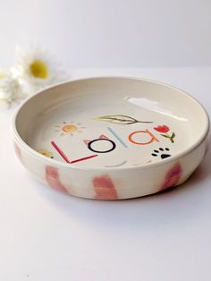 a bowl with the word love painted on it