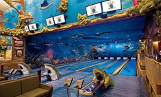 the bowling alley is decorated with an underwater theme and pictures on the wall above it