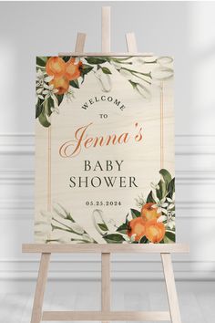 a wooden sign with flowers on it that says welcome to jenny's baby shower