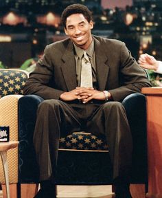 a man sitting in a chair on the tonight show