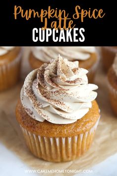 pumpkin spice cupcakes with white frosting and cinnamon sprinkles on top