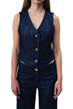 Demi Denim Suit - Vest Key Features: Durable navy blue denim for a classic and timeless appearance Three gold buttons for an elegant and refined touch Two bottom handkerchief pockets for added flair and functional convenience Satin Lining Made in the USA Details: Introducing our navy blue Demi Denim Vest—a sleek and stylish addition to elevate your ensemble with a perfect blend of fashion and comfort. Crafted from durable navy blue denim, this vest features three elegant gold buttons for a touch of sophistication. The two bottom handkerchief pockets add both flair and functional convenience. Size + Fit: The model is wearing a size small. Content & Care: Dry Clean Only. Our notes: Elevate your wardrobe with the Demi Denim Suit Vest—a chic and polished choice. Pair it effortlessly with the m Denim Suit, Denim Outerwear, Denim Blazer, Fly Girl, Suit Vest, Girl Blog, Gold Buttons, Denim Vest, Dark Denim