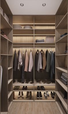 a walk in closet with wooden shelves and shoes on the floor, all lined up