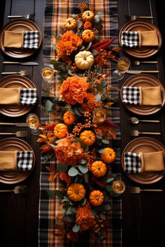 the table is set with pumpkins, flowers and other autumn decorations on top of it