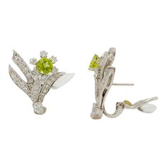 Beautiful earrings with 1.25 ct. peridot rounds, good quality white diamond rounds, and marquises.  Handmade in platinum.  These flower earrings are a great addition to any fine jewelry collection.  Metal: Platinum Stone: Diamond,Peridot Stone Cut: Round Cut  Dimensions for the item are unknown. Please reach out in the seller Q&A with questions Diamond Flower Earrings, Peridot Stone, Diamond Flower, Marquise Diamond, Fine Jewelry Collection, Stone Cuts, Flower Earrings, White Diamond, Beautiful Earrings