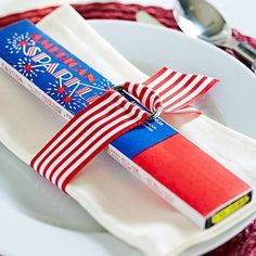 the napkins are wrapped in red, white and blue paper with an american flag design