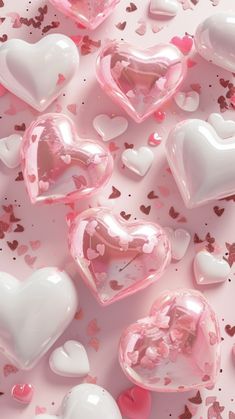 pink and white heart shaped candies on a pink background