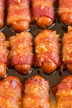 bacon wrapped hotdogs are ready to be cooked in the oven or on the grill