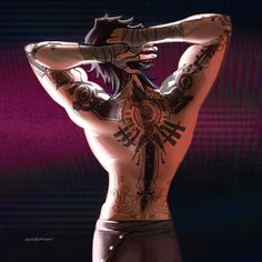 a man with tattoos on his back standing in front of a purple background