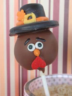 a chocolate turkey lollypop with a top hat on it