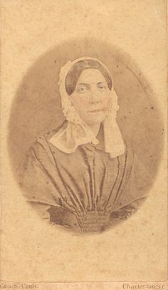 an old photo of a woman wearing a bonnet